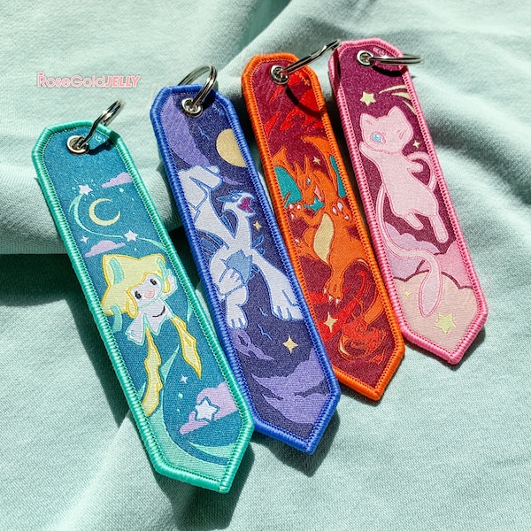 Jirachi, Lugia, Charizard, Mew Jet Tag Keychain (1.25 x 5 inch)