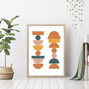 May include: Abstract geometric print with a white background and stacked shapes in shades of orange, yellow, pink, and teal.