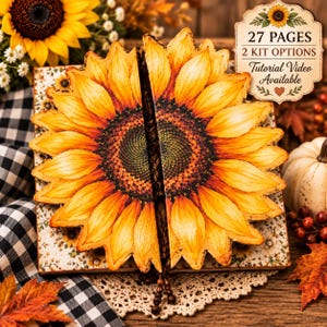 May include: A sunflower-shaped craft kit featuring a split cover design with yellow and orange petals. The text reads 27 PAGES, 2 KIT OPTIONS, and Tutorial Video Available. The item is displayed with a sunflower, a white pumpkin, and autumn leaves.