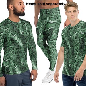 May include: Three-piece set of clothing with a green snakeskin pattern. The set includes a long-sleeve shirt, leggings, and a short-sleeve t-shirt. The text "items sold separately" is visible at the top of the image.