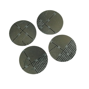 May include: Four round, gray, textured, plastic bases with a design of cracked pavement and a grid pattern.
