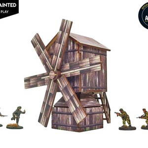 May include: A miniature wooden windmill model with a dark brown plank texture and a large rotating blade assembly, accompanied by four small painted soldier figurines in combat poses, featuring the text PRE PAINTED and BOLT ACTION.