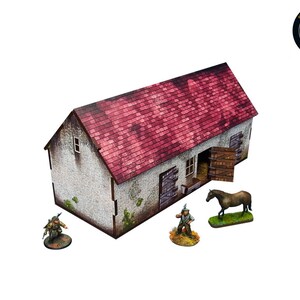 May include: A miniature stone building with a red tiled roof, open wooden doors, and a small window. There is a miniature horse and two miniature figures standing outside the building.