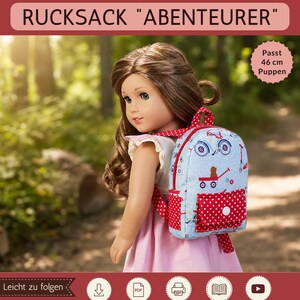 May include: A doll with brown hair wears a light blue backpack featuring a red and white polka dot front pocket and a pattern of small red wagons and bicycles. The backpack has red straps and is designed for 18-inch dolls. Text includes Sami Dolls, Rucksack Abenteurer, and PDF Schnittmuster.