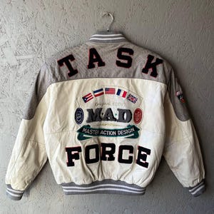 May include: A rustic wooden sign with the text "Welcome to our home" in white lettering. The sign features a distressed finish and a simple, inviting design, perfect for entryway decor.