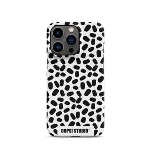 May include: A white phone case with a black dalmatian spot pattern. The case has a camera cutout and the text "OOPS! STUDIO" at the bottom. The case is designed to fit a smartphone.