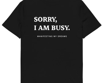 Désolé(e), je suis occupé(e). T-shirt unisexe bio – un style affirmé.