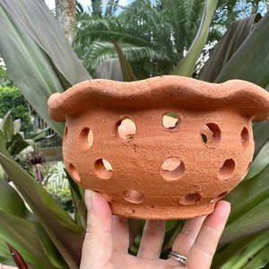 Orchid clay pot with ruffles and holes, no hanger.