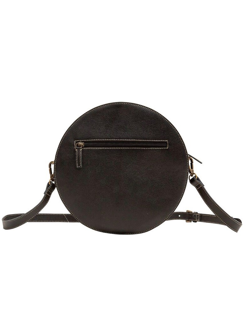 May include: A black round leather crossbody bag with a top zipper closure and an adjustable strap.