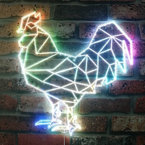 May include: A geometric neon rooster sign with a multicolored glow. The rooster is outlined with bright neon lights, and the design is mounted on a brick wall. The neon colors include orange, green, blue, and purple.
