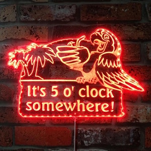 May include: Red neon sign with a cartoon parrot holding a tropical drink and the text "It's 5 o'clock somewhere!"