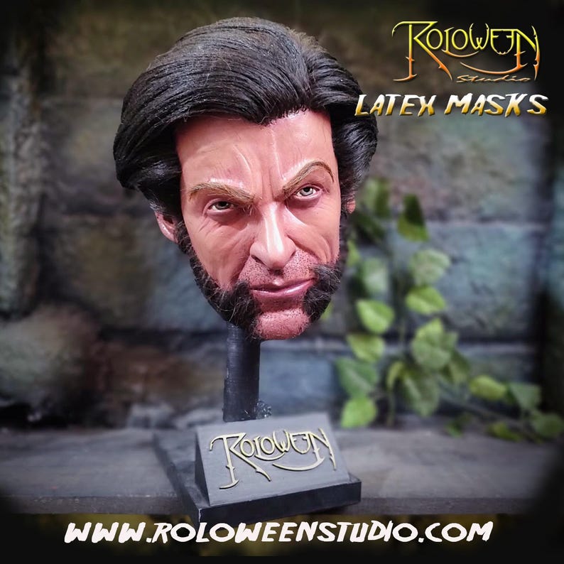 May include: A hand-painted latex mask of Wolverine, a popular comic book character, on a black stand with the words "Roloween Studio" in gold lettering. The mask has a realistic appearance with detailed facial features and a brown beard. The stand has a small plaque with the same lettering as the stand.