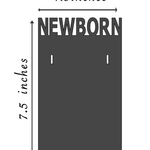 May include: A dark gray sign that reads "NEWBORN" in cut-out letters. The sign is 4.5 inches wide and 7.5 inches tall. It has two small holes near the top for hanging. The sign is designed for a newborn baby.
