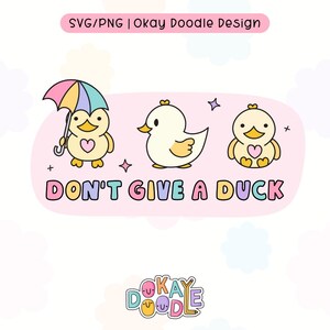 May include: A pink and yellow illustration of three cartoon ducks. One duck is holding a colorful umbrella. The text "DON'T GIVE A DUCK" is written in rainbow colors below the ducks. The text "OKAY DOODLE" is written in rainbow colors at the bottom of the image.