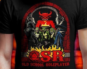 May include: Black t-shirt with a graphic of a red demon and green monsters in a brick archway. The text "SR OLD SCHOOL ROLEPLAYER" is below the graphic. The text "OSR COMPATIBLE THREADS!" is in a red box in the upper right corner.