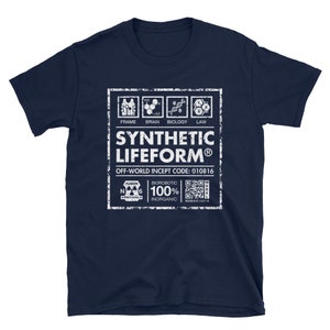 May include: A navy blue t-shirt featuring a white graphic of a label that reads "SYNTHETIC LIFEFORM&reg;" with the text "OFF-WORLD INCEPT CODE: 010816" and a QR code. The label also includes the text "FRAME, BRAIN, BIOLOGY, LAW" and "BIOROBOTIC 100% INORGANIC".