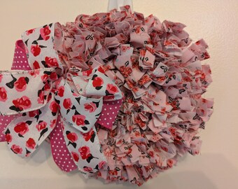 Mini corona de flores rosas