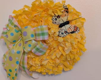 Mini corona de mariposas de tela amarilla