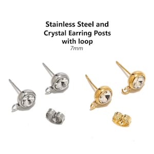 May include: Two pairs of earring posts with crystal tops and a loop. One pair is silver and the other is gold. The posts are 7mm long.  Stainless Steel and Crystal Earring Posts with loop 7mm