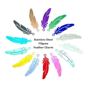May include: A selection of colourful stainless steel filigree feather charms. The charms are in various colours, including teal, yellow, red, and purple. The text "Stainless Steel Filigree Feather Charm" is displayed in the centre.