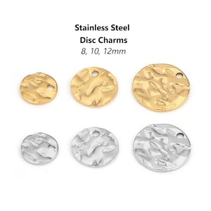 May include: Six stainless steel disc charms in two sizes and two finishes. Three gold charms are 8mm, 10mm, and 12mm in diameter. Three silver charms are 8mm, 10mm, and 12mm in diameter.
