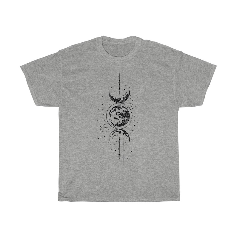 May include: A heather gray t-shirt featuring a black graphic of the phases of the moon. The design includes crescent moons, a full moon, stars, and lines. The shirt is a casual, unisex style.