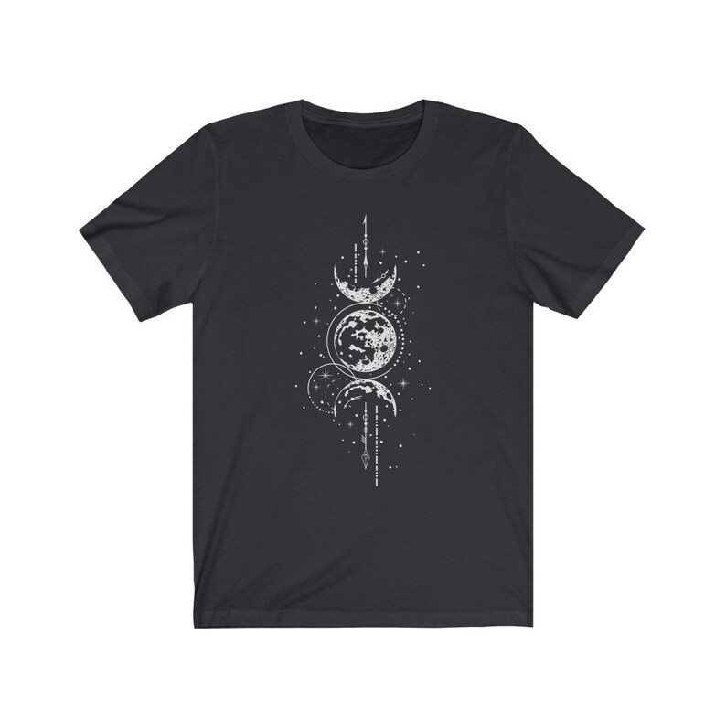 May include: A black t-shirt with a white graphic design of three moons in different phases, surrounded by stars and geometric shapes.