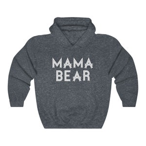 May include: A dark blue hooded sweatshirt with the text "MAMA BEAR" printed in white on the front.