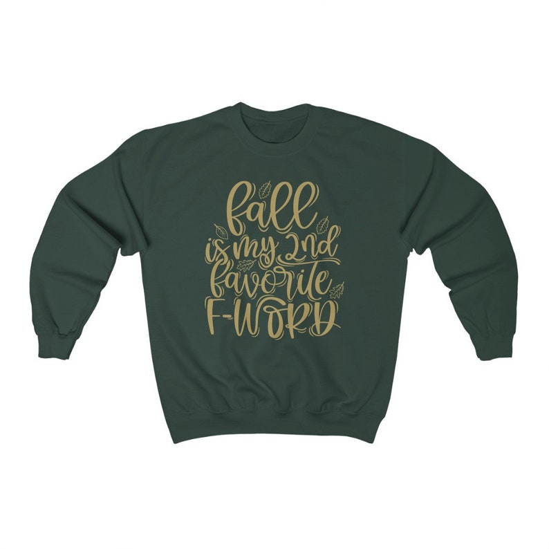 May include: A dark green sweatshirt with the text "fall is my 2nd favorite F-word" in gold lettering. The text is surrounded by small leaf designs.