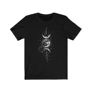 May include: Black t-shirt with a white graphic of three moons in different phases, surrounded by stars and a geometric design.