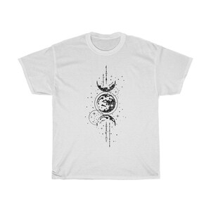May include: White t-shirt featuring a black graphic of the phases of the moon, stars, and celestial lines. The design is centered on the front of the shirt. The shirt is made of a soft, comfortable material.