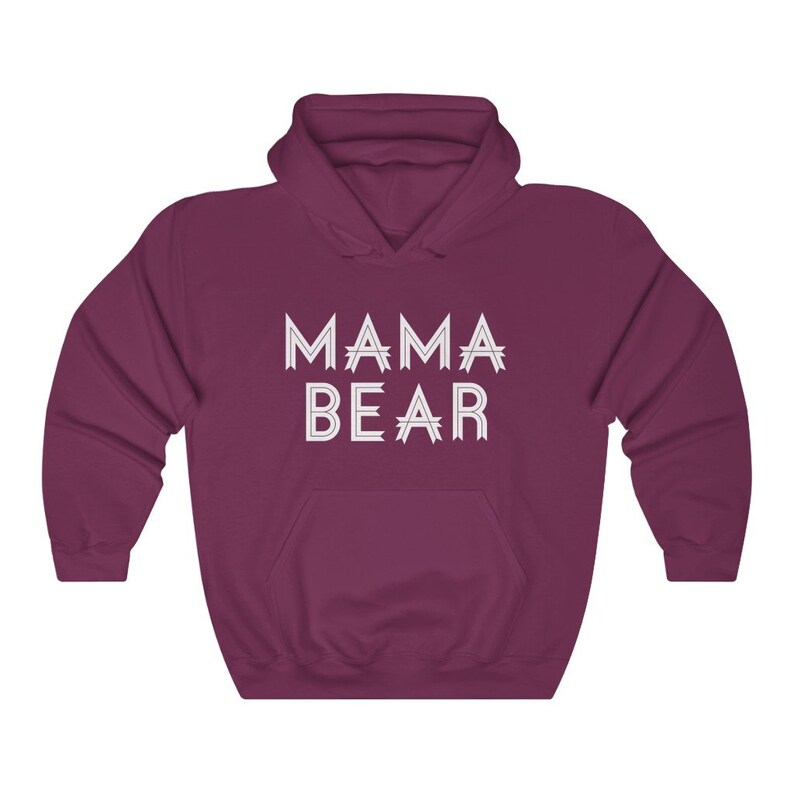 May include: A maroon hooded sweatshirt with the text "MAMA BEAR" in white outlined letters.