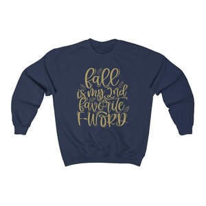 May include: Navy blue sweatshirt with a gold graphic that says "Fall is my 2nd favorite F-word".