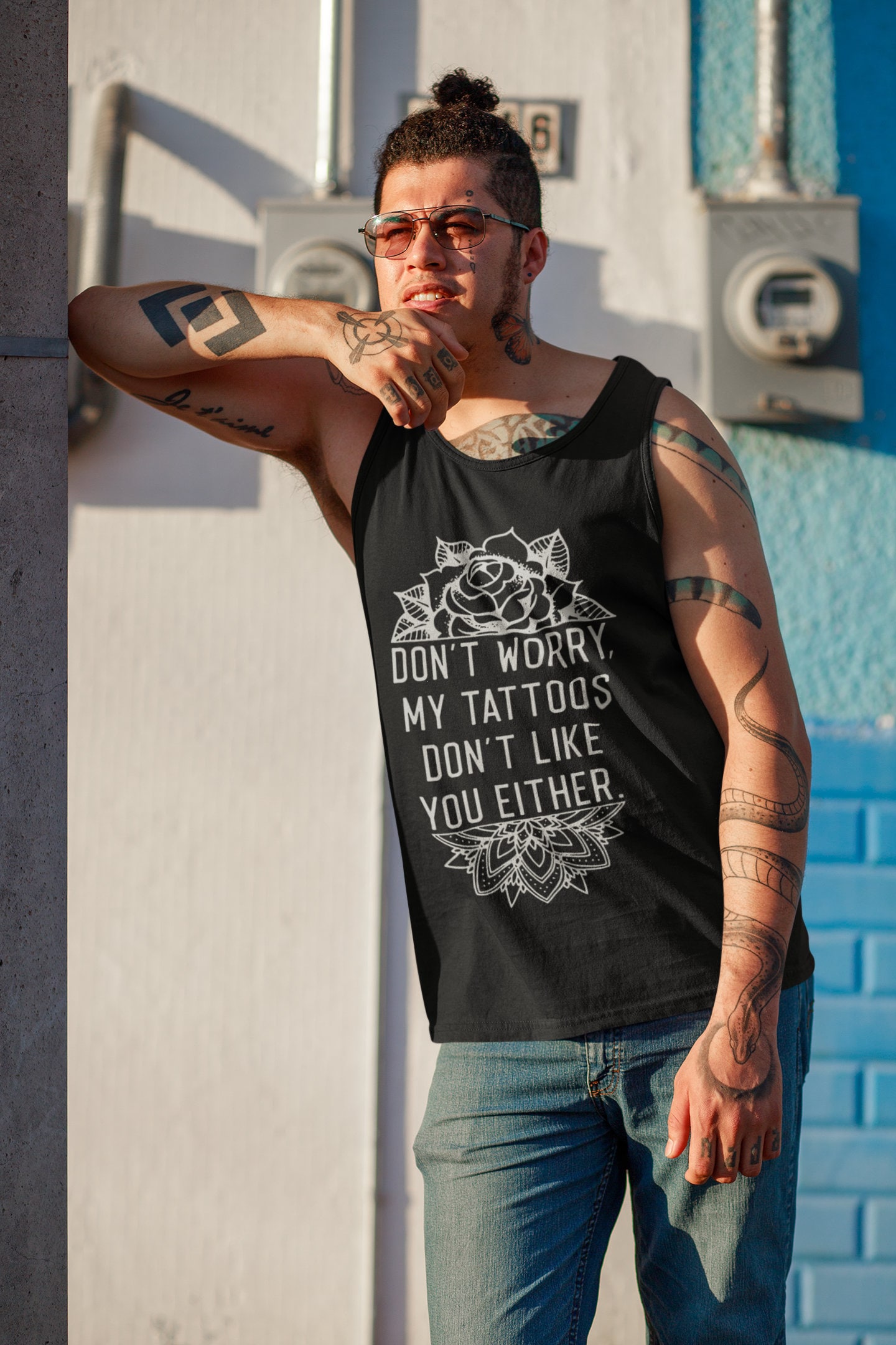 Premium Photo  A man with tattoos on his arms and a black tank top