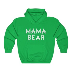 May include: Green hooded sweatshirt with the text "MAMA BEAR" in white outlined letters.