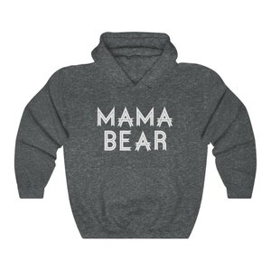 May include: A dark gray hooded sweatshirt with the text "MAMA BEAR" printed in white on the front.