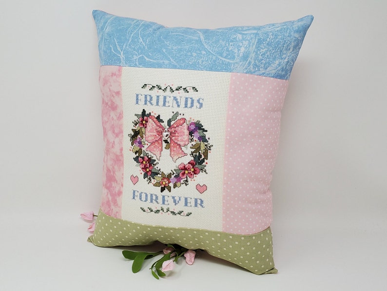 Finished Cross-Stitched FRIENDS FOREVER ANGEL Pillow on 14 count white aida with Silver Heart Charm