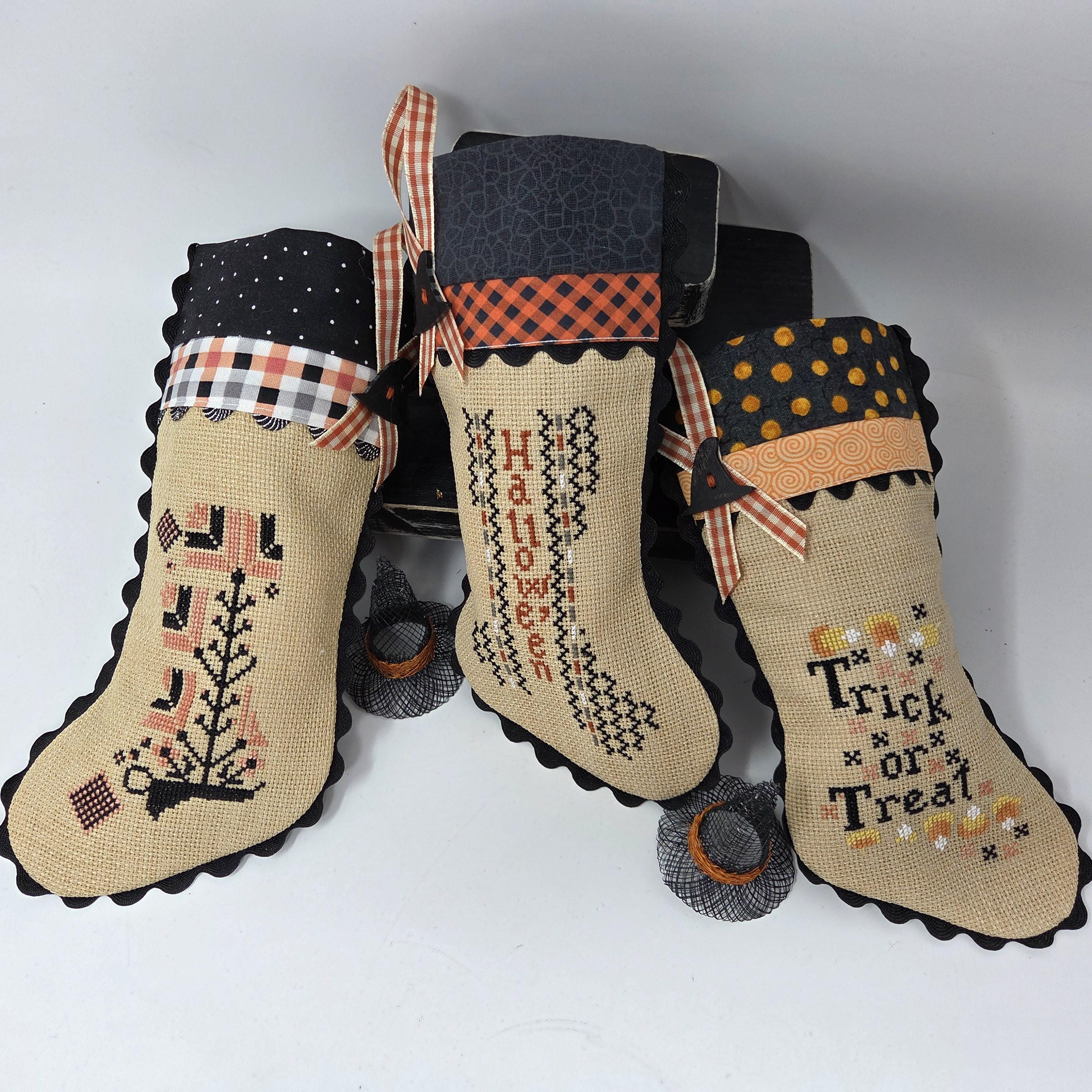 Blackbird Designs cross-stitched HALLOWEEN STOCKINGS on 32 count Mocha Linen Aida with Rickrack, Bias, Ribbon, Button 9 x 5 inches