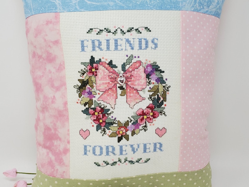 Finished Cross-Stitched FRIENDS FOREVER ANGEL Pillow on 14 count white aida with Silver Heart Charm