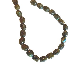 May include: A strand of dark green labradorite gemstone beads, strung together to form a necklace. The beads are oval-shaped and have a slight iridescent sheen.