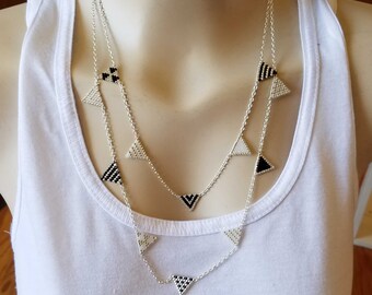 Woven beaded necklace with a refined pendant design, handmade in France