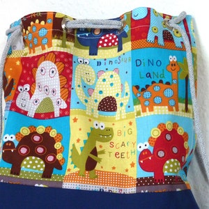 Bolsa de ginástica infantil "Funny Dinos" com crachá impermeável softshell e forro interno azul colorido 28/32 W/H