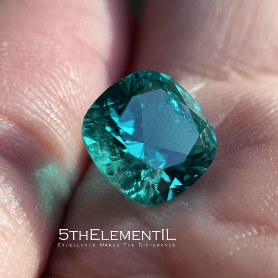 Colombian Emerald Cushion Cut. Lab Grown Hydrothermal Bluish-Green Emerald With Some Natural Inclusions.