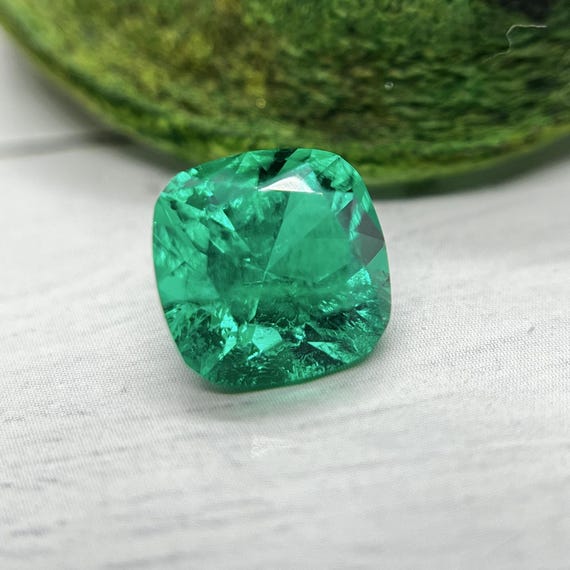 8mm Colombian Emerald Cushion Cut. Lab Grown Hydrothermal Bluish-Green Emerald With Some Natural Inclusions.