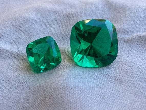 Colombian Emerald Cushion Cut. Lab Grown Hydrothermal Bluish-Green Emerald With Some Natural Inclusions.