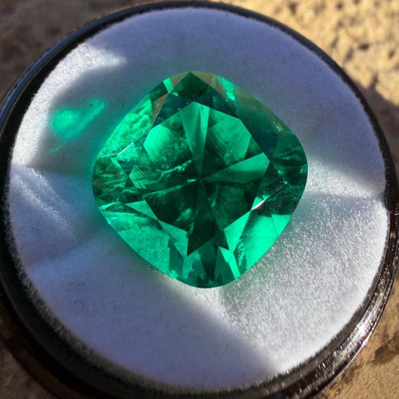 Colombian Emerald Cushion Cut. Lab Grown Hydrothermal Bluish-Green Emerald With Some Natural Inclusions.