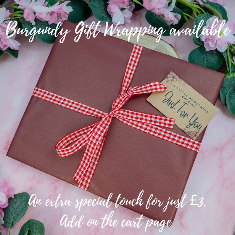 May include: Burgundy gift wrapping with a red and white checkered ribbon and a gift tag that says "A little something special, Just for you". An extra special touch for just $3. Add on the cart page.