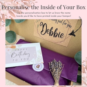 May include: A cardboard gift box containing purple tissue paper, a small bundle of dried lavender, and a white card with the text "HAPPY BIRTHDAY TO YOU". A label inside the box features the text "thinking just for you... Debbie".