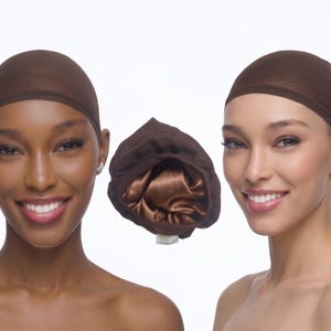 May include: A dark brown hair bonnet featuring a smooth, satin-like interior lining and a gathered, elasticized outer edge. The bonnet is shown in a central position, displayed alongside two individuals wearing identical dark brown caps.