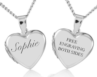 May include: Silver heart-shaped locket necklace with a chain. The locket is engraved with the name "Sophie" on one side and "FREE ENGRAVING BOTH SIDES" on the other side.